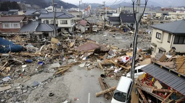 Debris left by the tsunami litters a street in the town of Ofunato in Iwate prefecture