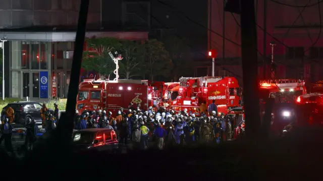 Fire engines and emergency personnel outside the Aeon Mall