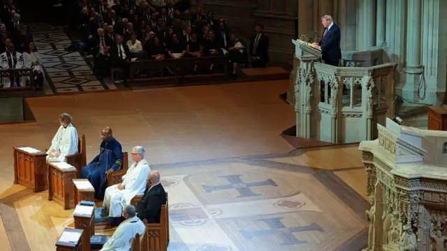President Donald Trump, standing behind a podium, delivers remarks during the funeral service for the late U.S. Sen. Lindsey Graham at the Washington National Cathedral.