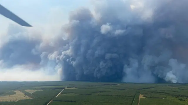 A photo from French fire department shows a pyrocumulonimbus over the village of Saumos in Gironde on Saturday, 25 July