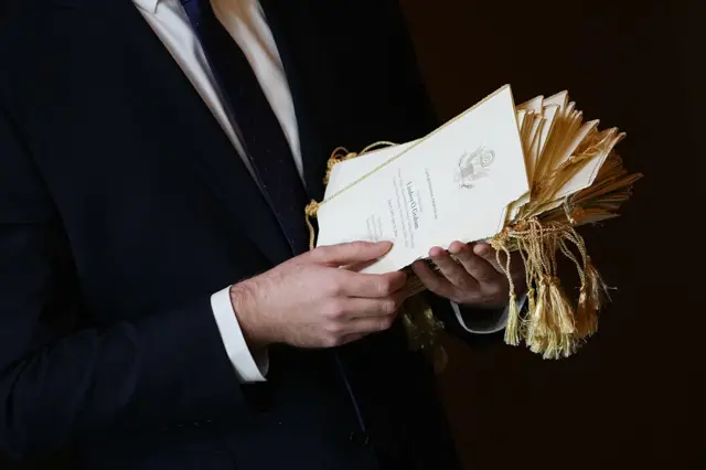 A person hands out programs ahead of a Congressional Tribute to the late U.S. Senator Lindsey Graham (R-SC) in the Rotunda of the US Capitol on July 28, 2026 in Washington, DC.