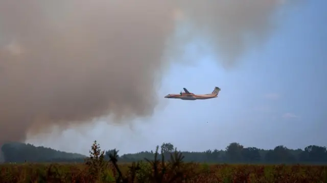 A firefighting plane over an area of France on Monday.
