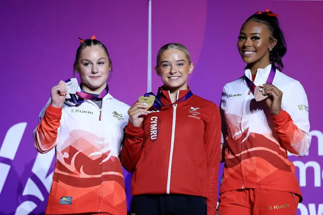 Ruby Evans with gold medal for women's floor