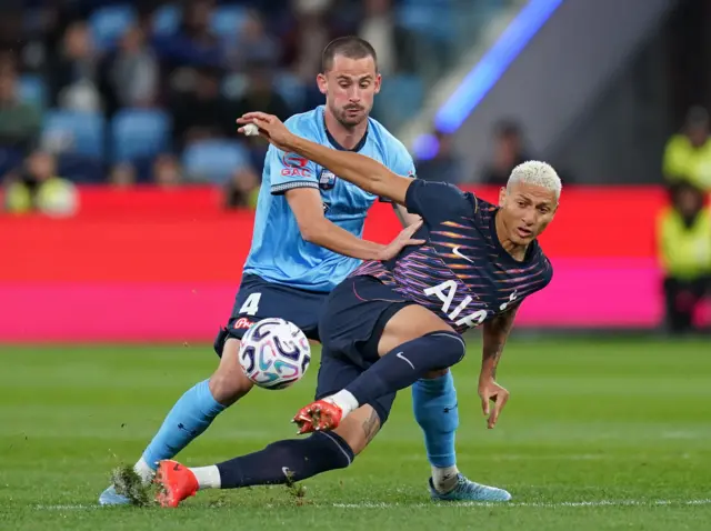 Sydney FC's Jordan Courtney Perkins (left) and Tottenham Hotspur's Richarlison battle for the ball