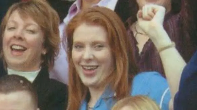 Angela Rayner smiles and raises her fist in an old photo showing her as a care worker for Stockport Council. She is surrounded by