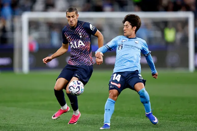 Tye Hall of Tottenham Hotspur competes with Takahiro Sekine of Sydney FC