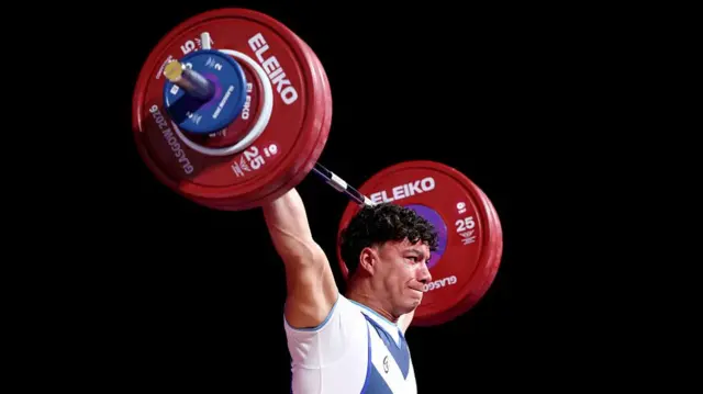 Tom Wright lifting weights for Scotland