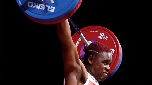 Madias Ngake lifting weights for England