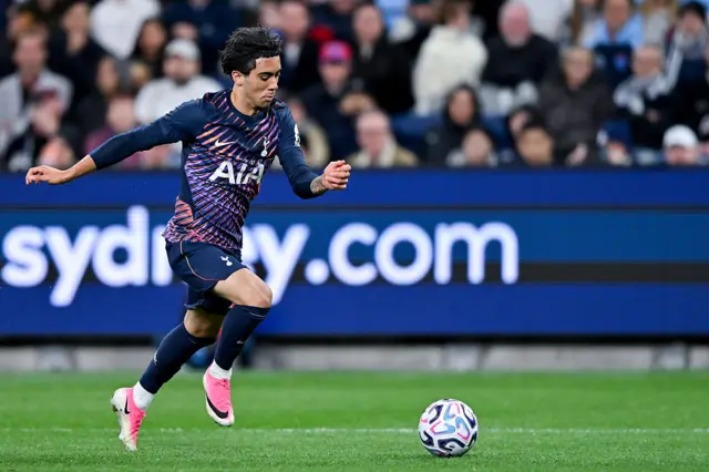 Luca Williams-Barnett of Tottenham Hotspur dribbles the ball