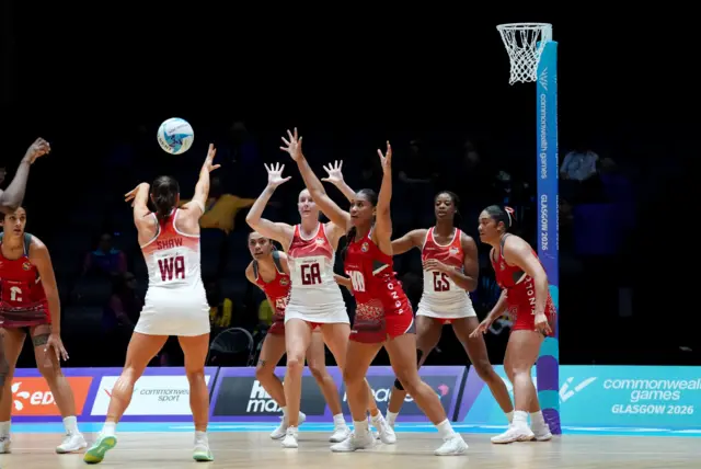 Jessica Shaw (left) of England passes the ball to Sasha Glasgow (centre) during the Netball Preliminary Round Pool A match at The Hydro during day six of the 2026 Commonwealth Games in Glasgow.