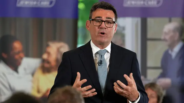 Andy Burnham speaks to residents, care workers, volunteers and the media during a care home visit in London