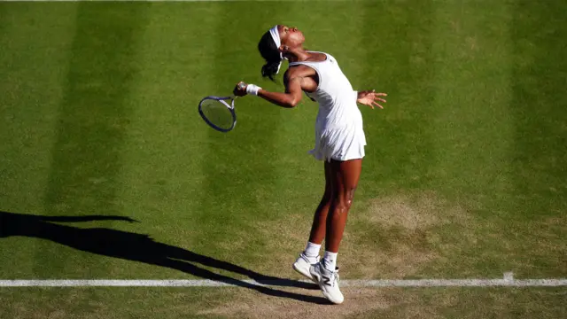 Coco Gauff serves