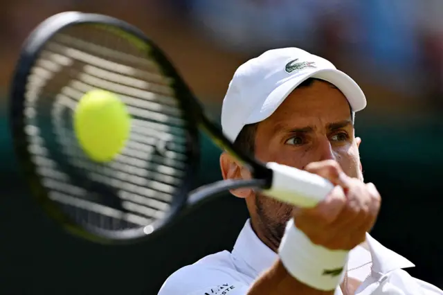 Novak Djokovic returns
