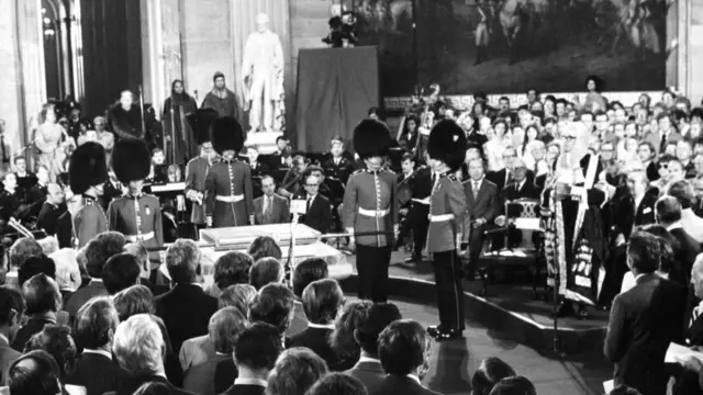 Wide shot of the presentation ceremony of the Magna Carta from members of the House of Lords to Congress members in the Capitol Building Rotunda