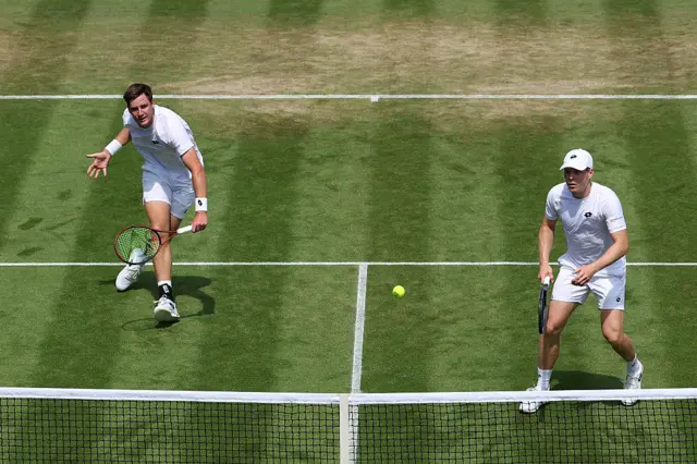 Henry Patten hits a backhand volley