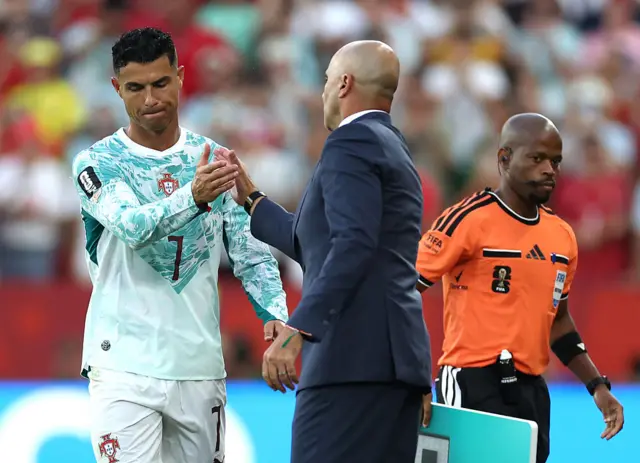 Roberto Martinez, Head Coach of Portugal, shakes hands with Cristiano Ronaldo