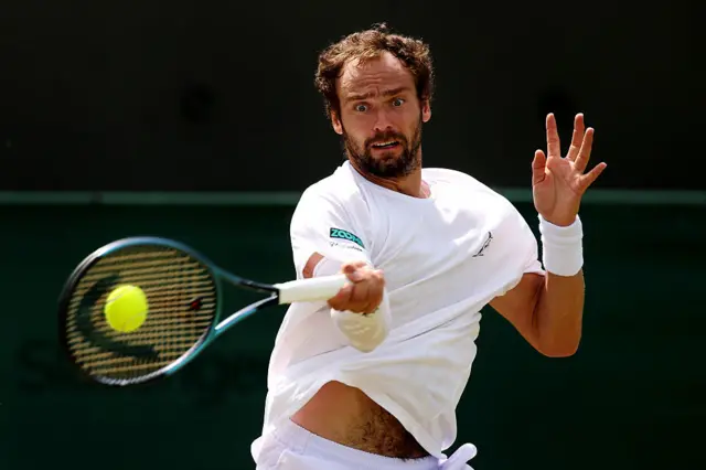 Roman Safiullin plays a forehand