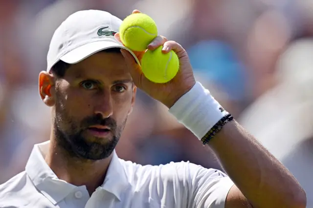 Novak Djokovic prepares to serve