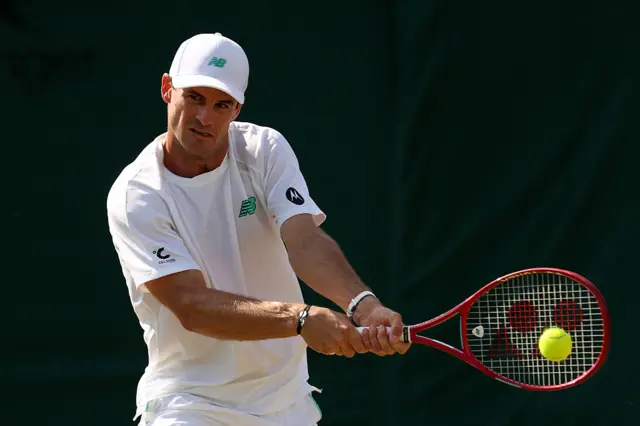 Hubert Hurkacz of Poland plays a backhand