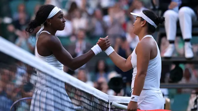 Coco Gauff of United States and Claire Liu of United States interact at the net