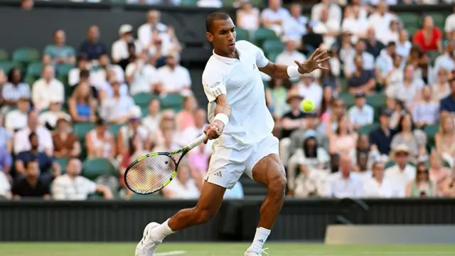 Felix Auger-Aliassime of Canada plays a forehand