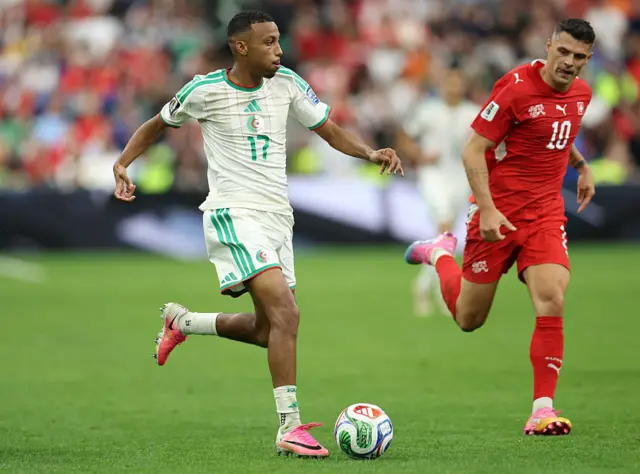 Rafik Belghali controls the ball under pressure from Granit Xhaka