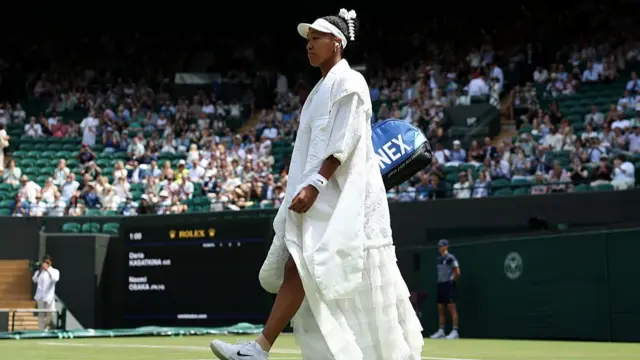 Naomi Osaka of Japan walks onto court