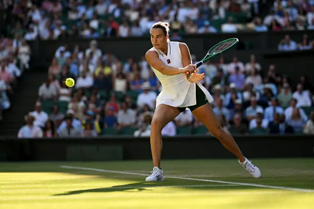 Aryna Sabalenka plays a backhand