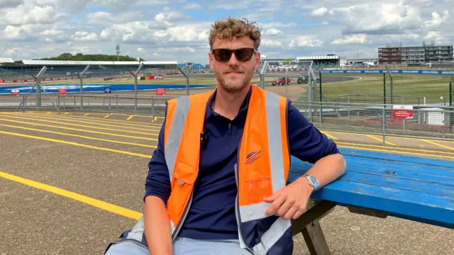 Silverstone operations manager Tom Watson sat on a bench at the circuit