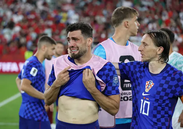 Mateo Kovacic #8 and Luka Modric #10 of Croatia react