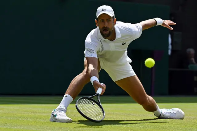 Novak Djokovic reaches for a return shot