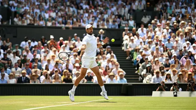 Novak Djokovic of Serbia plays a forehand