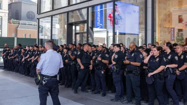 Large columns of police officers stand outside MSG