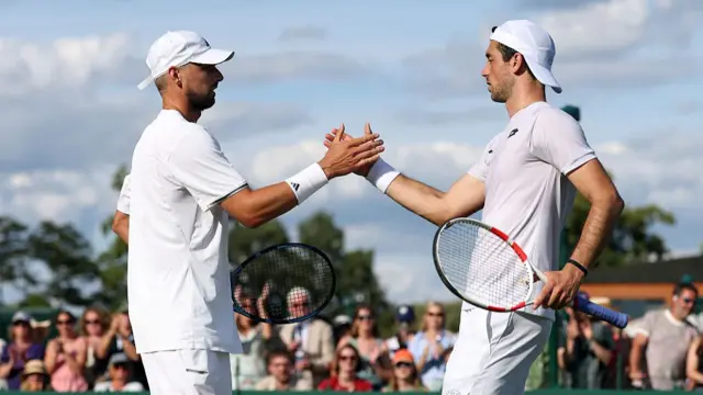 Julian Cash and Lloyd Glasspool high five