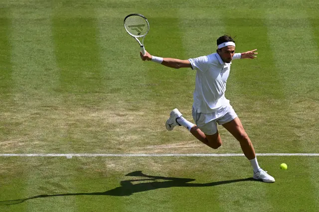 Arthur Rinderknech of France plays a backhand slice