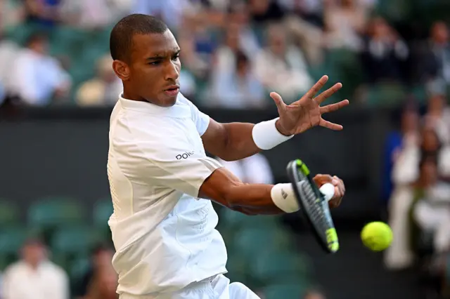 Felix Auger-Aliassime of Canada plays a forehand