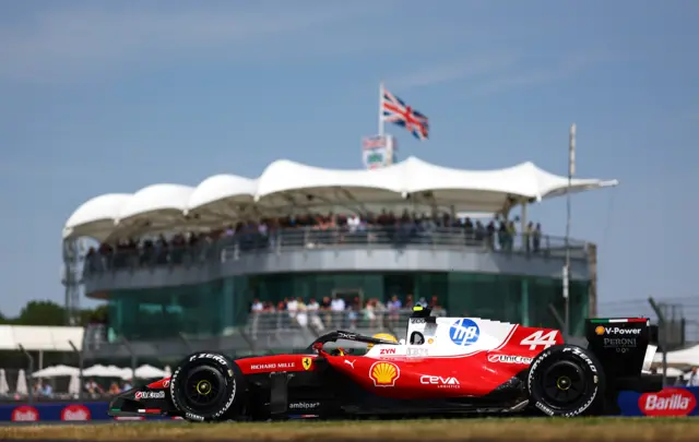 Ferrari's Lewis Hamilton in front of a grandstand during practice for the British Grand Prix at Silverstone