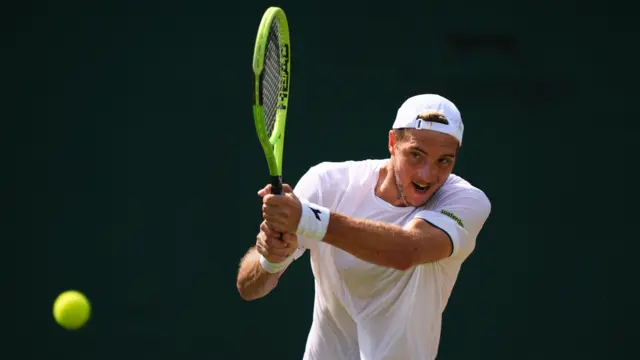 Jan-Lennard Struff hits a backhand