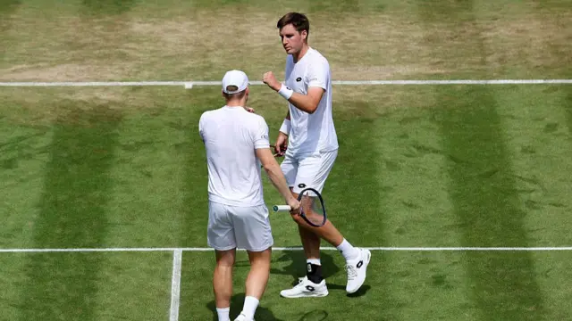 Henry Patten of Great Britain and Harri Heliovaara of Finland interact