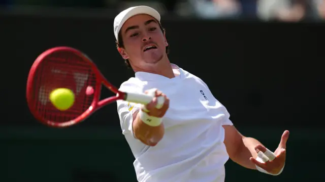 Joao Fonseca hits a forehand