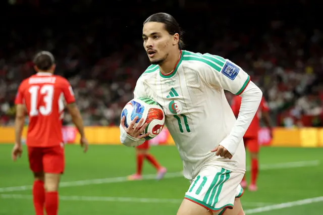 Anis Hadj Moussa looks on