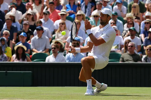 Novak Djokovic runs in for a volley