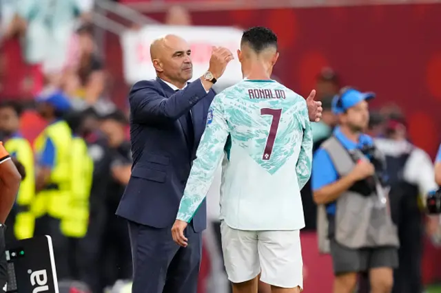Cristiano Ronaldo of Portugal greets Roberto Martinez