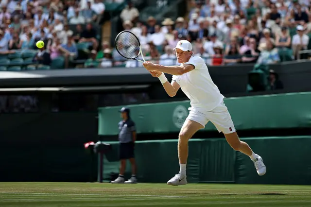 Jannik Sinner of Italy plays a backhand