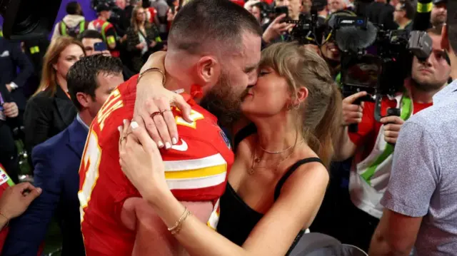 Travis Kelce #87 of the Kansas City Chiefs and Taylor Swift embrace after defeating the San Francisco 49ers in overtime during Super Bowl LVIII at Allegiant Stadium on February 11, 2024 in Las Vegas, Nevada