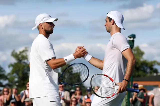 Julian Cash of Great Britain and Lloyd Glasspool of Great Britain interact