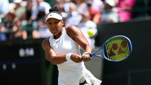 Naomi Osaka of Japan plays a backhand