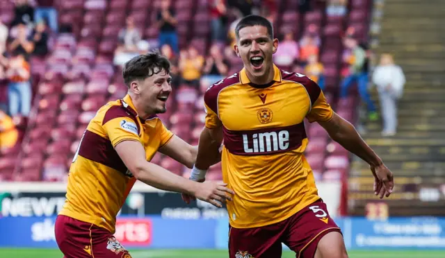 Motherwell defender Martin Moormann (right) celebrates after scoring