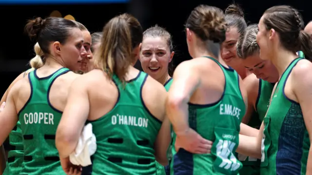 Northern Ireland's players gather for a team talk during their Pool A loss to Australia