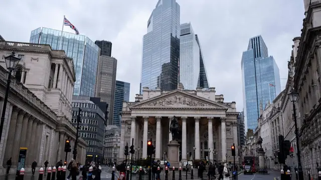 A view of the City of London, featuring the Bank of England, as well as several tall skyscrapers in the background